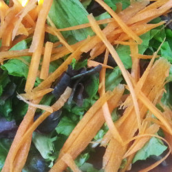 shredded carrots on a salad