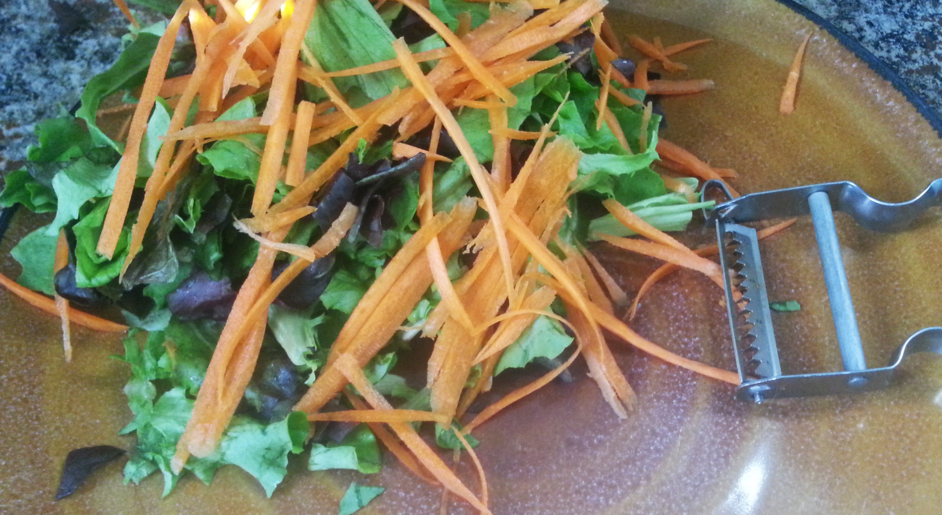 shredded carrots on a salad